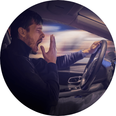 Man yawning while driving